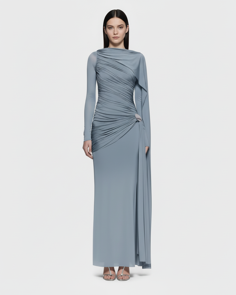 Woman wearing a long, light blue dress with a draped design on a white background
