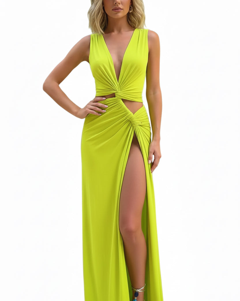 Woman wearing a bright yellow evening gown with a high slit on a white background