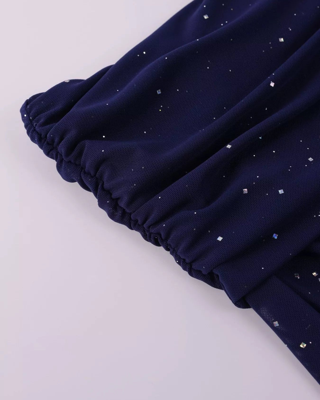 Valentina off-shoulder glitter evening gown close up hands fabric
