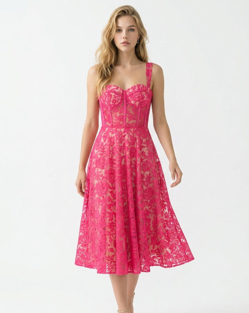 Woman wearing a pink lace dress on a white background