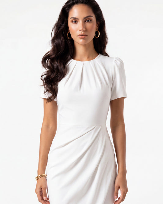 Woman wearing a white dress on a white background
