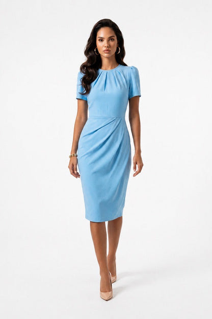 Woman wearing a light blue dress on a white background