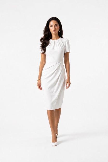Woman wearing a white dress on a white background