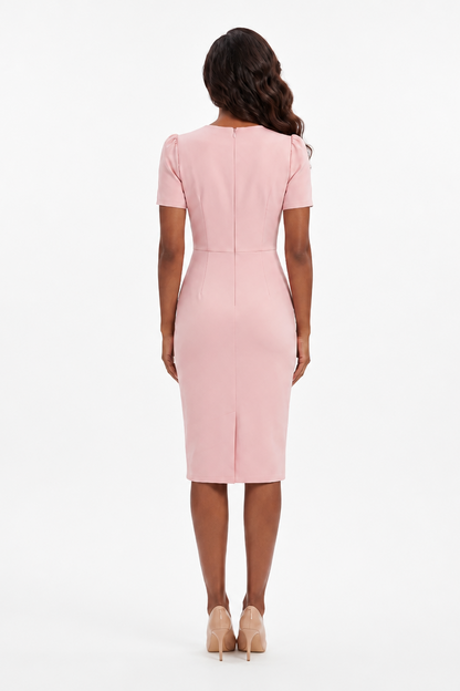 Woman wearing a pink dress on a white background