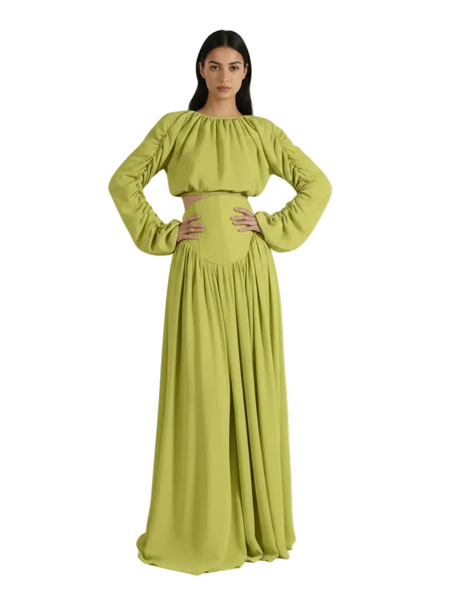 Woman wearing a green outfit on a beige background